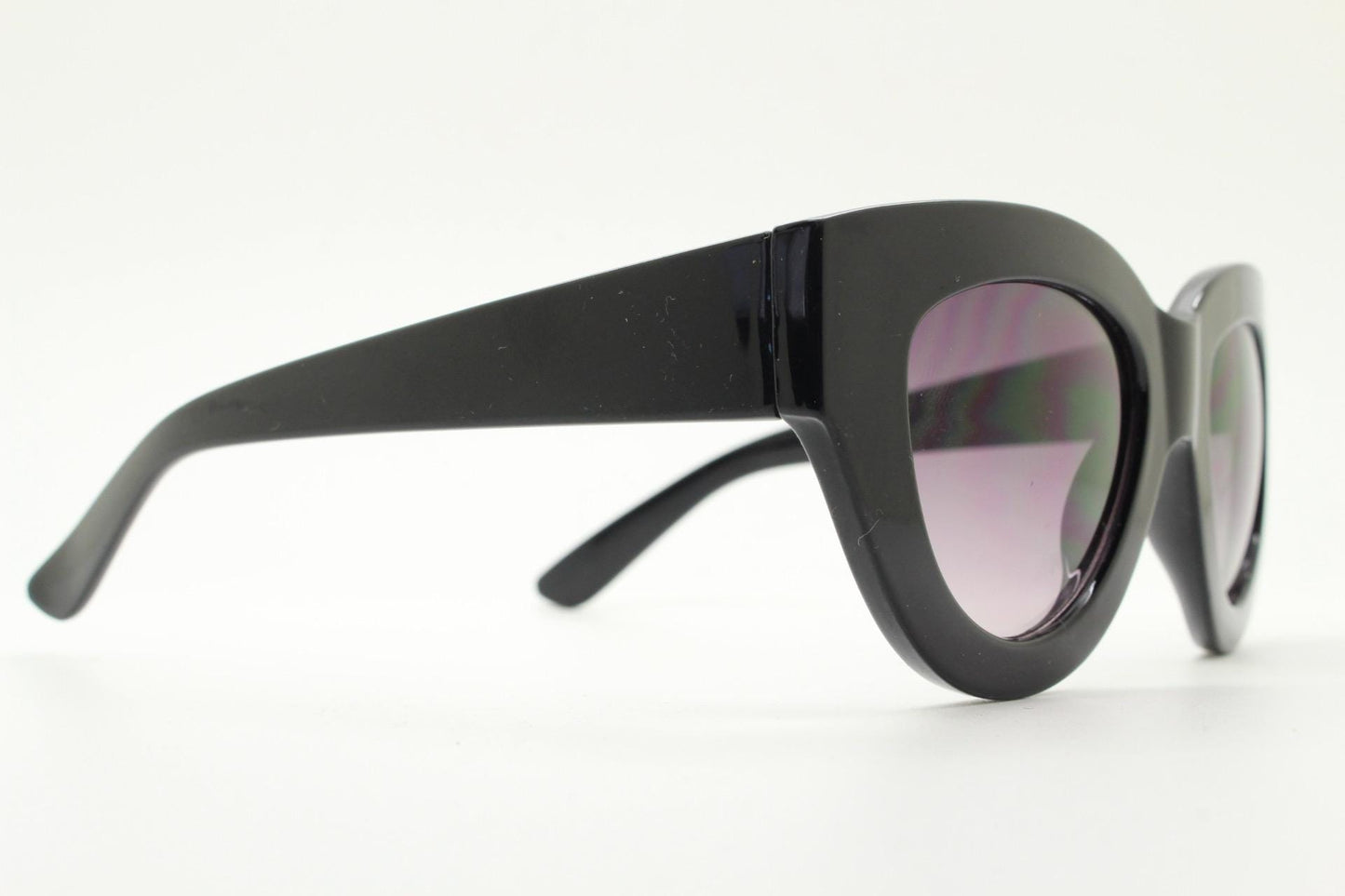 Y2K vintage thick oversized cateye sunglasses. Womens black gloss big arm cat eye frame with gradient lenses. 2000s NOS
