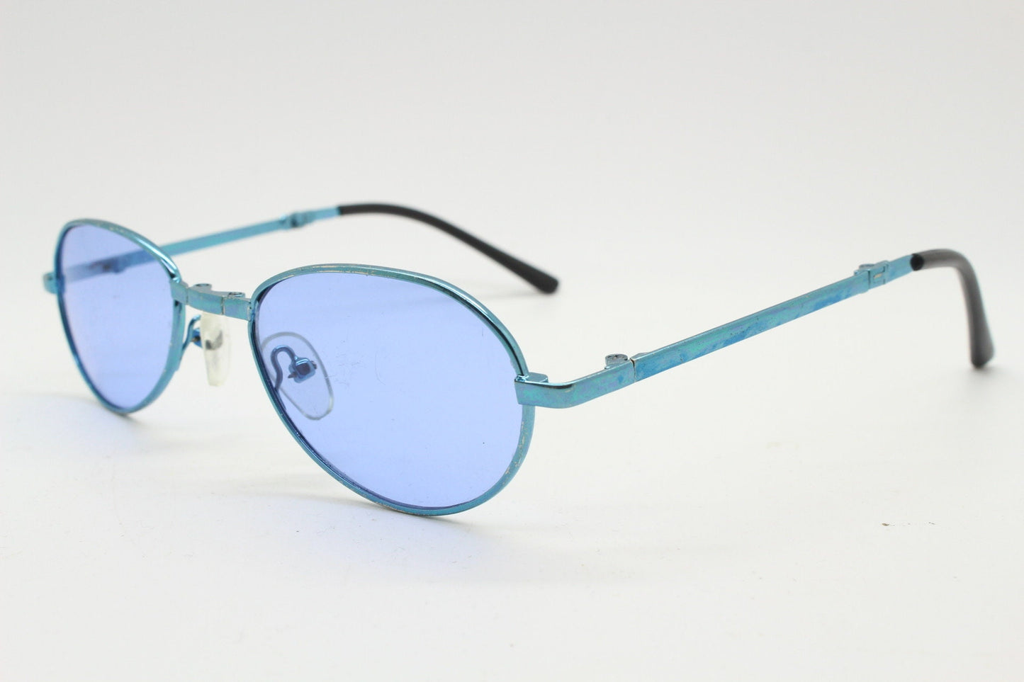 Y2K micro foldable oval sunglasses. Sky lenses in a small folding matching coloured compact frame. Folder. Rave 2000s. 90s NOS