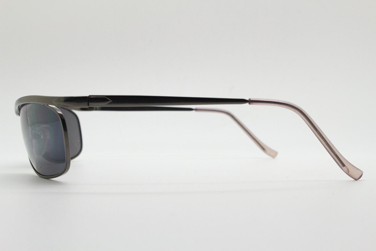 Y2K vintage curved oval sunglasses. Minimal grey chrome metal aerodynamic sport shaped frame. 2000's. 00's NOS