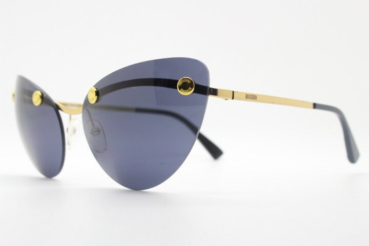 Moschino oval cat eye sunglasses model 082/S. Womens frameless cateye in perfect proportions with golden metal brow line