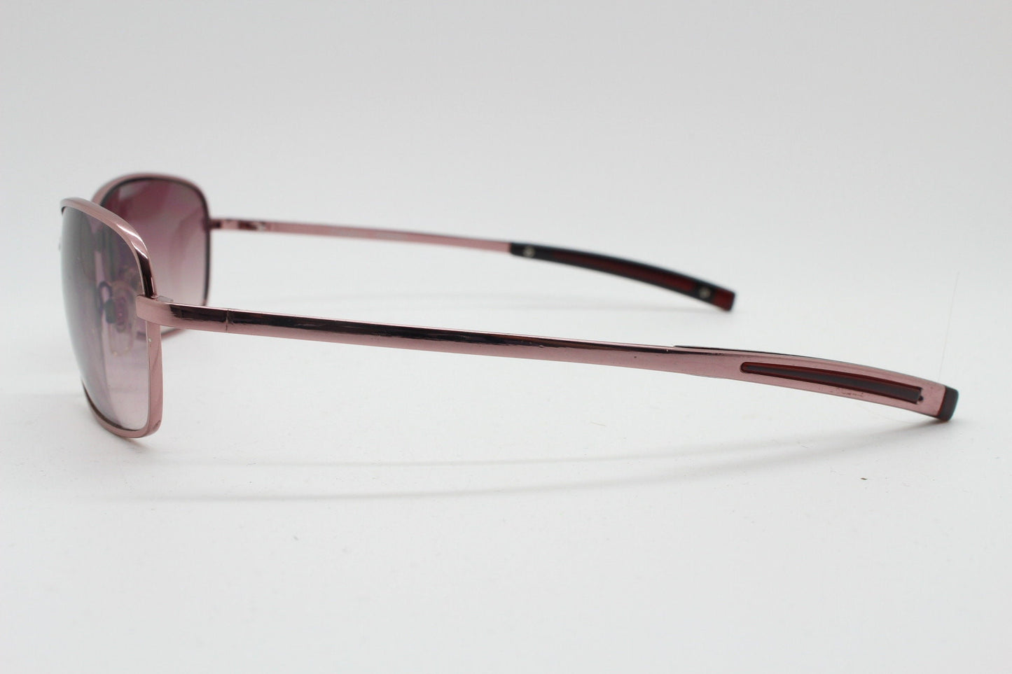 Y2K vintage curved sunglasses. Unusual Pink chrome metal frame with matching flared rectangular lenses. Unused 2000s NOS