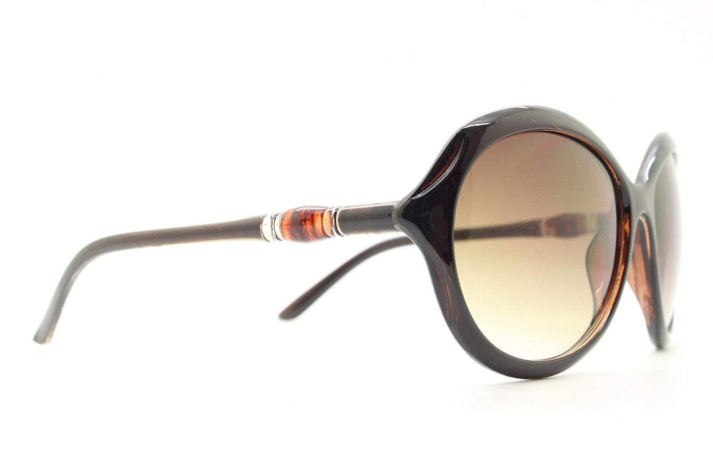 Y2K vintage big round sunglasses. Women's classical 60s design in brown gloss with graduating lenses and subtle arm detail. 2000s. 00s NOS