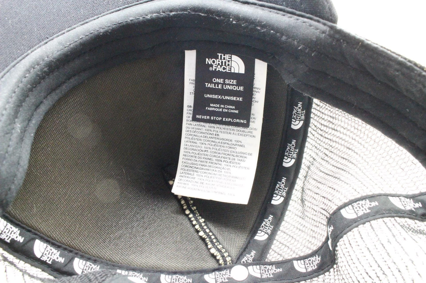 The North Face plain black baseball cap with big white spell out logo. Classic trucker style hat with fully adjustable back