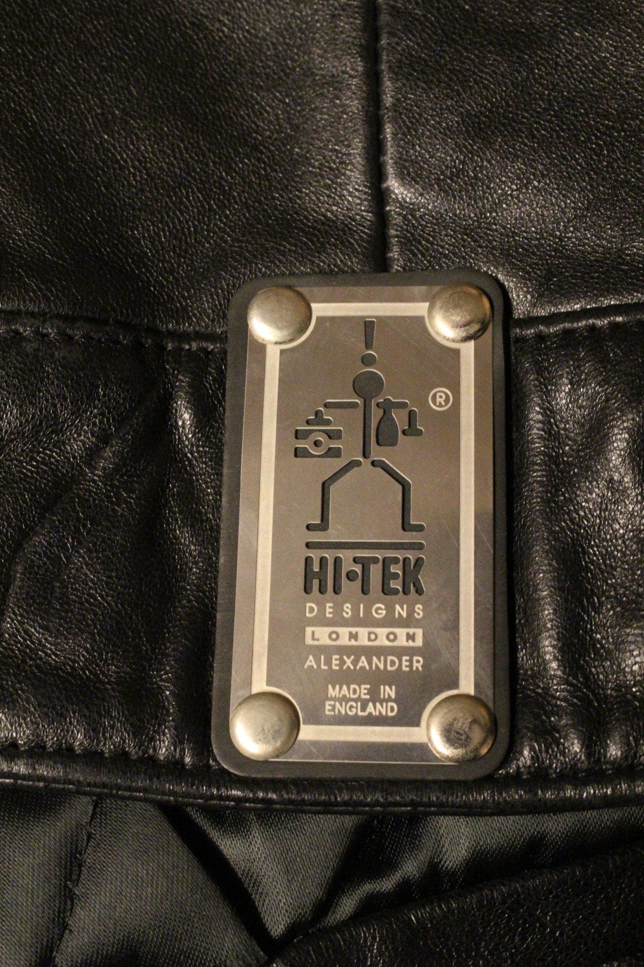 Hi-Tech 90s vintage black leather jacket. Made in England. Cropped oversized blouson design. Double breasted with chrome metal
