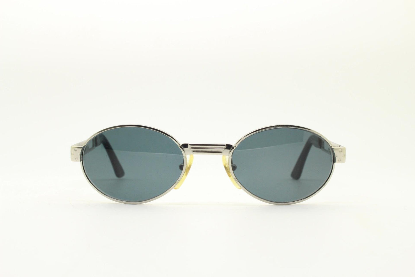 Prestige 90s vintage oval small bug eye sunglasses model 4028 made in Italy. Chrome finish solid metal frame with indented arm pattern. NOS