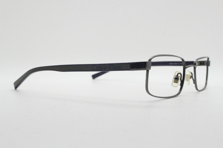 Calvin Klein collection rectangular eye glasses model 582 made in Japan. Gunmetal grey wire optical frames. Prescription eyeglasses. RX