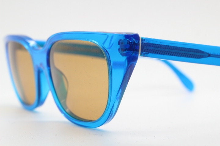 Retrosuperfuture thick cat eye sunglasses hand made in Italy. Intense blue acetate chunky frame with contrasting brown lenses. BNWOT