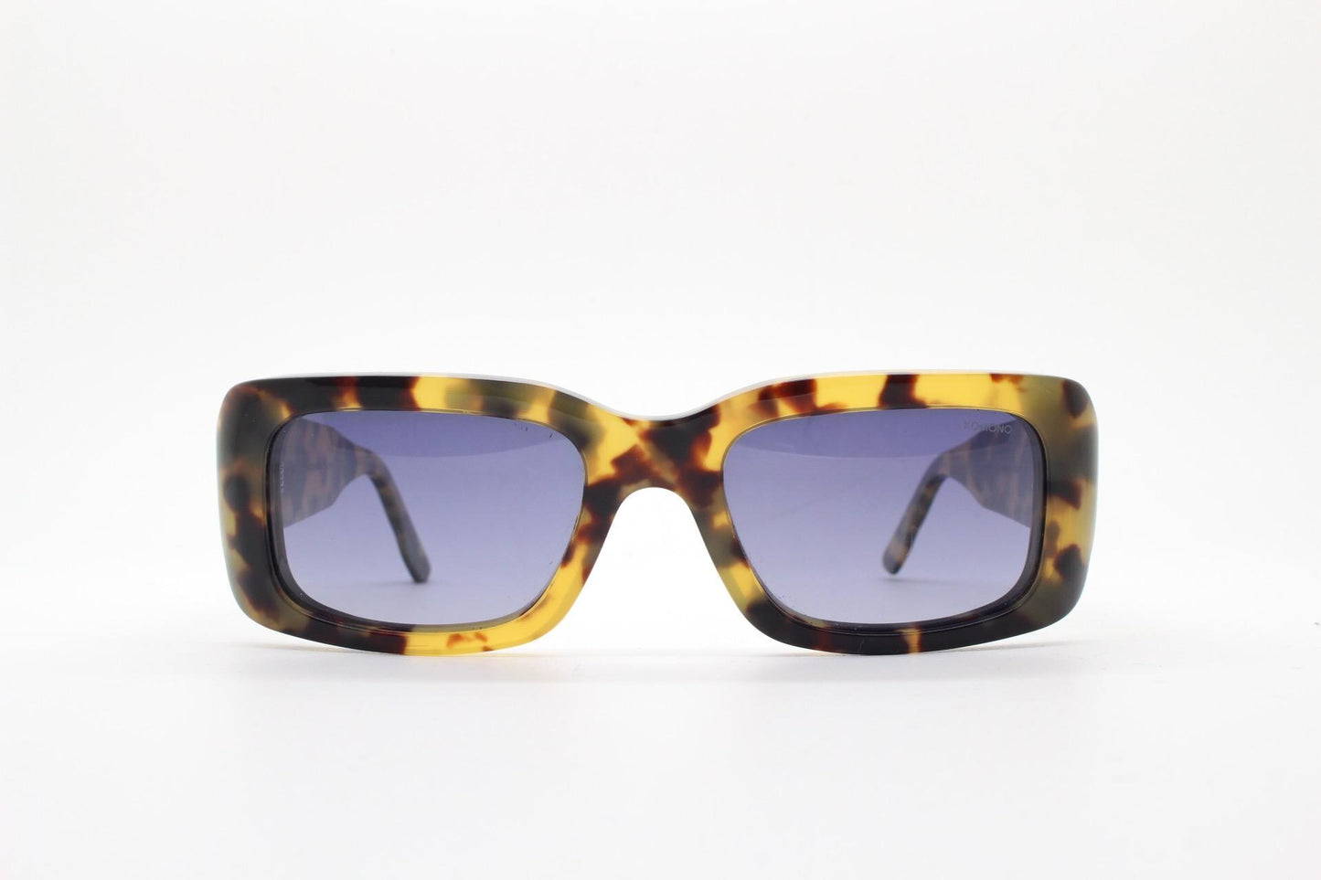 Komono chunky rectangular sunglasses model The Wes. Thick framed honey tortoise eco acetate with curved back 'goggle' sides and tall arms.