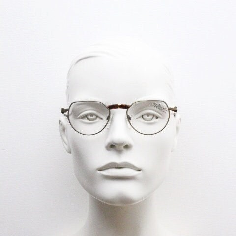 Silhouette vintage 90s flat top oval eye glasses made in Austria. Satin bronze optical frame with honey tortoise trim. Prescription RX