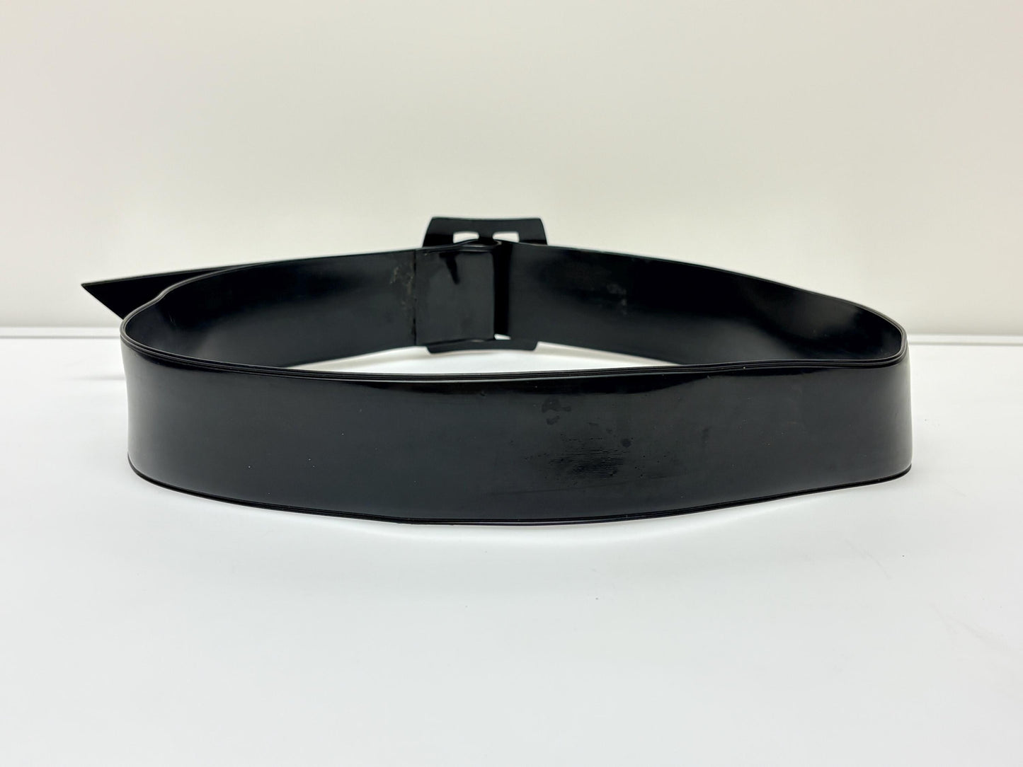 80s vintage womens shiny fetish 2" dress belt. All black seamless vinyl with well matched flat buckle. 50s kinky pin up bad girl