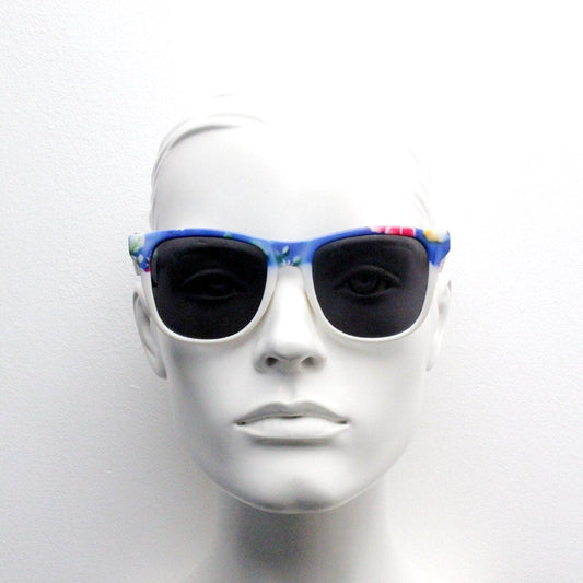 80s vintage floral wayfarer style sunglasses. Dreamy florid blue frame with contrasting black lensses. Unused NOS. Y2K fluorescent rave