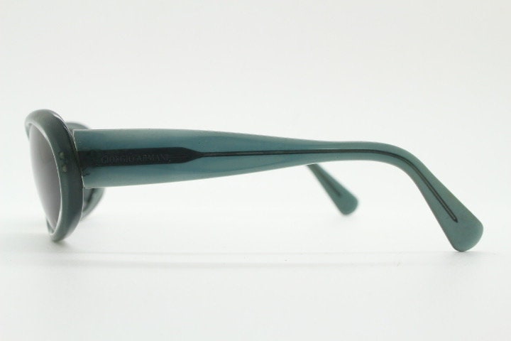 Giorgio Armani 90s vintage oval sunglasses made in Italy. Transparent grey\blue acetate frame with matching lenses. Small bug eye. Y2K