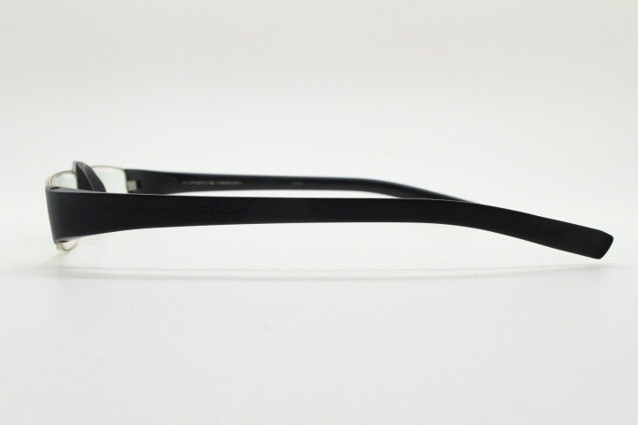 Porsche design rectangular eye glasses. Minimal grey metal optical frame in a matt finish with black arms. Vintage Prescription spectacles