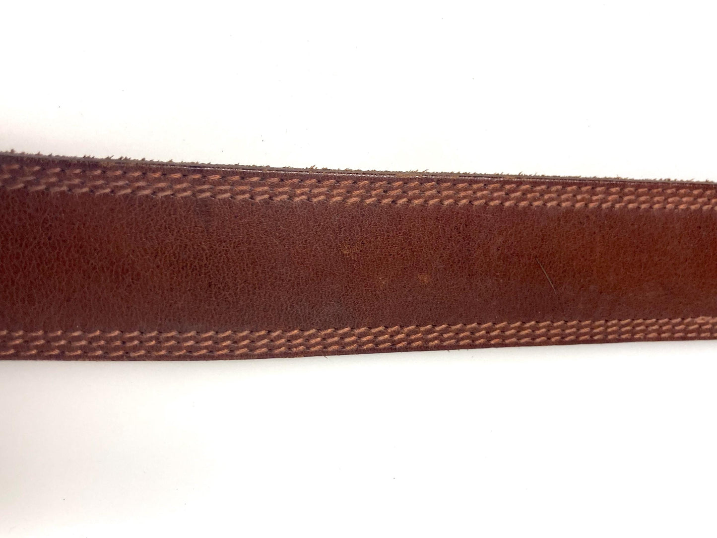 80s vintage jeans or trousers belt with brass buckle. Tan brown substantial single cut genuine leather construction with triple stitching
