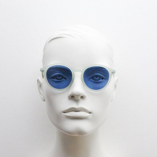 Sergio Tacchini 80s vintage round horn rim sunglasses made in Italy. Transparent pale blue frosted acetate frame with navy lenses. NOS