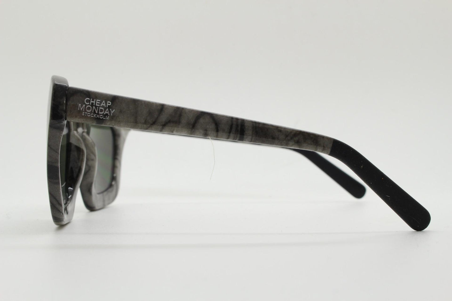 Cheap Monday thick frame cateye sunglasses. Womens chunky oversized grey and black marble cat eye with dark green lenses. Y2k vintage