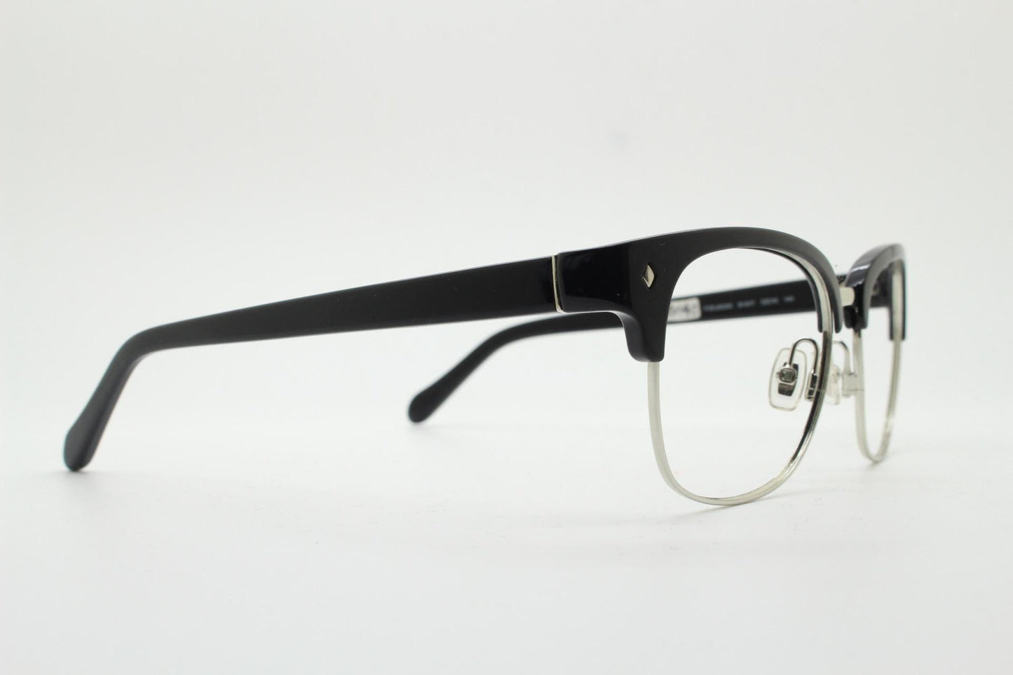 Fossil brow line eye glasses. Sharp and clean clubmaster format. Silver optical frames with black browline. Prescription eyeglasses. RX