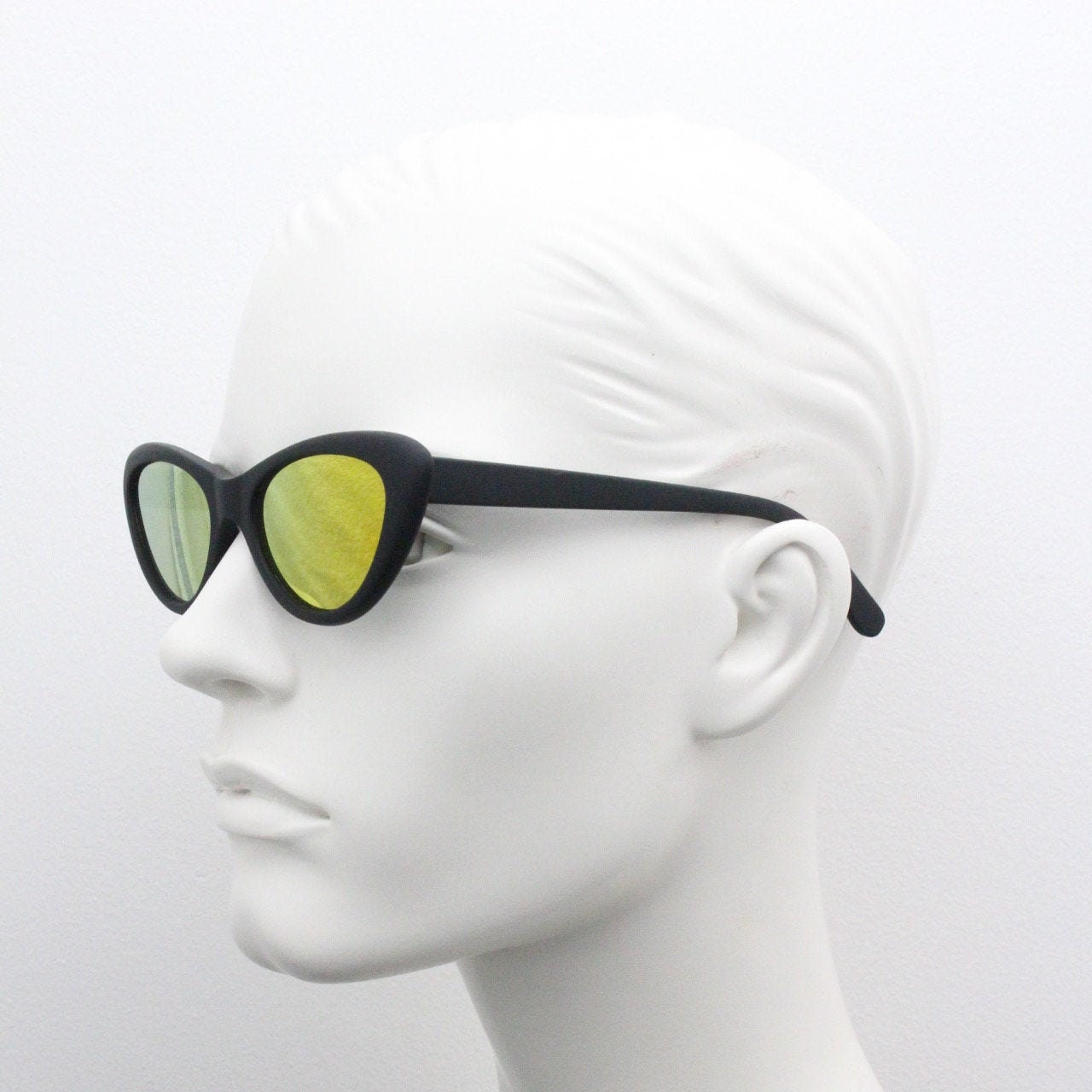 Vintage 90s oval cat eye sunglasses. Womens black rubber finish cat eye frame with gold mirror lenses. Rockabilly cats eye. Unused NOS