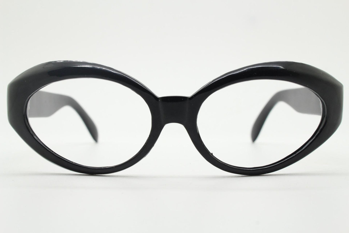 80s vintage oval cat eye glasses. Crop sided dynamic black cateye optical frames. 60s design prescription eyeglasses. RX spectacles. NOS