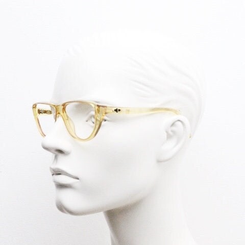 Christian Dior 80s vintage flat top cat eye glasses made in Germany. Transparent yellow optical frame with abstract print. Prescription RX
