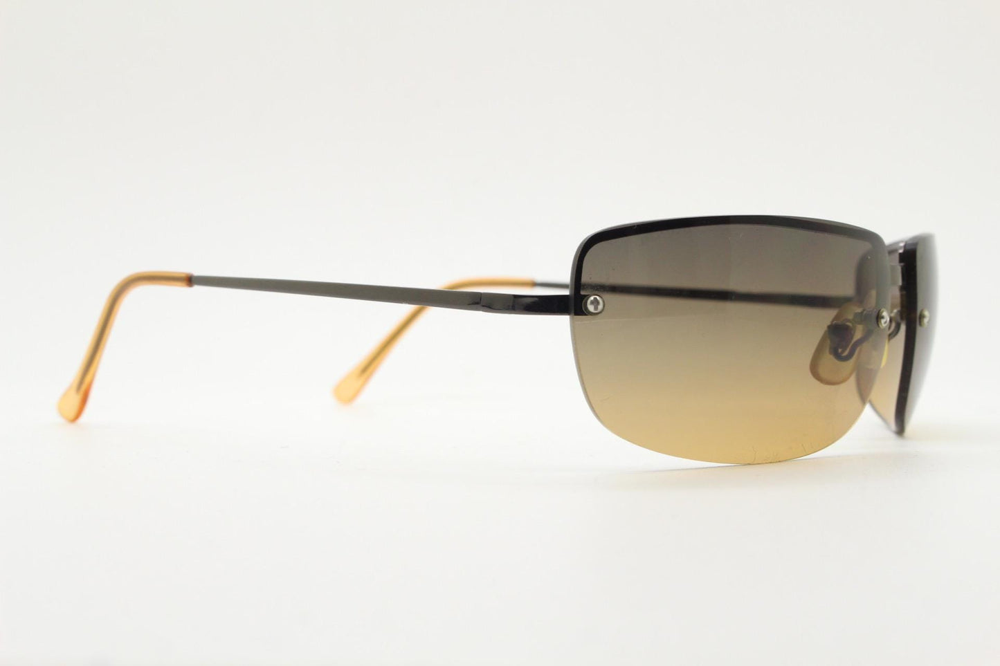 Y2K vintage curved rectangular sunglasses. Minimal half frame in brown chrome with grey to amber fade lenses. 2000's. 00's NOS