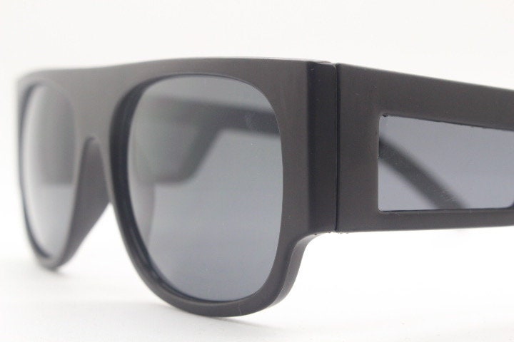 Y2K vintage rectangular side panel sunglasses. Black matt frame with grey lenses and side window spoilers / blinkers. 2000s NOS goggle