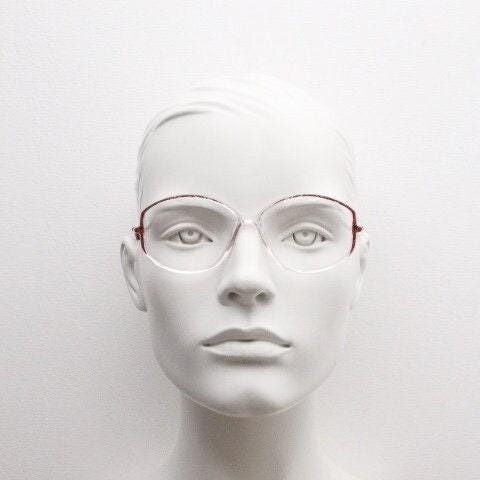 Silhouette 80s vintage hexagon eye glasses made in Austria. Transparent crystal optical frame with abstract red pattern. Prescription RX