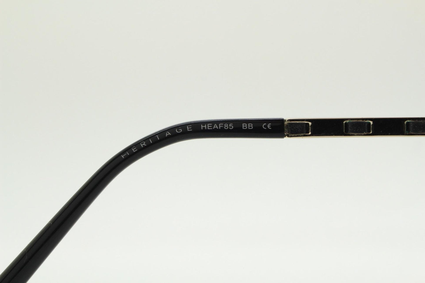Vintage elegant cat eye glasses by Heritage. Black gloss acetate optical frames with leather lattice arms. Prescription RX cateye spectacles