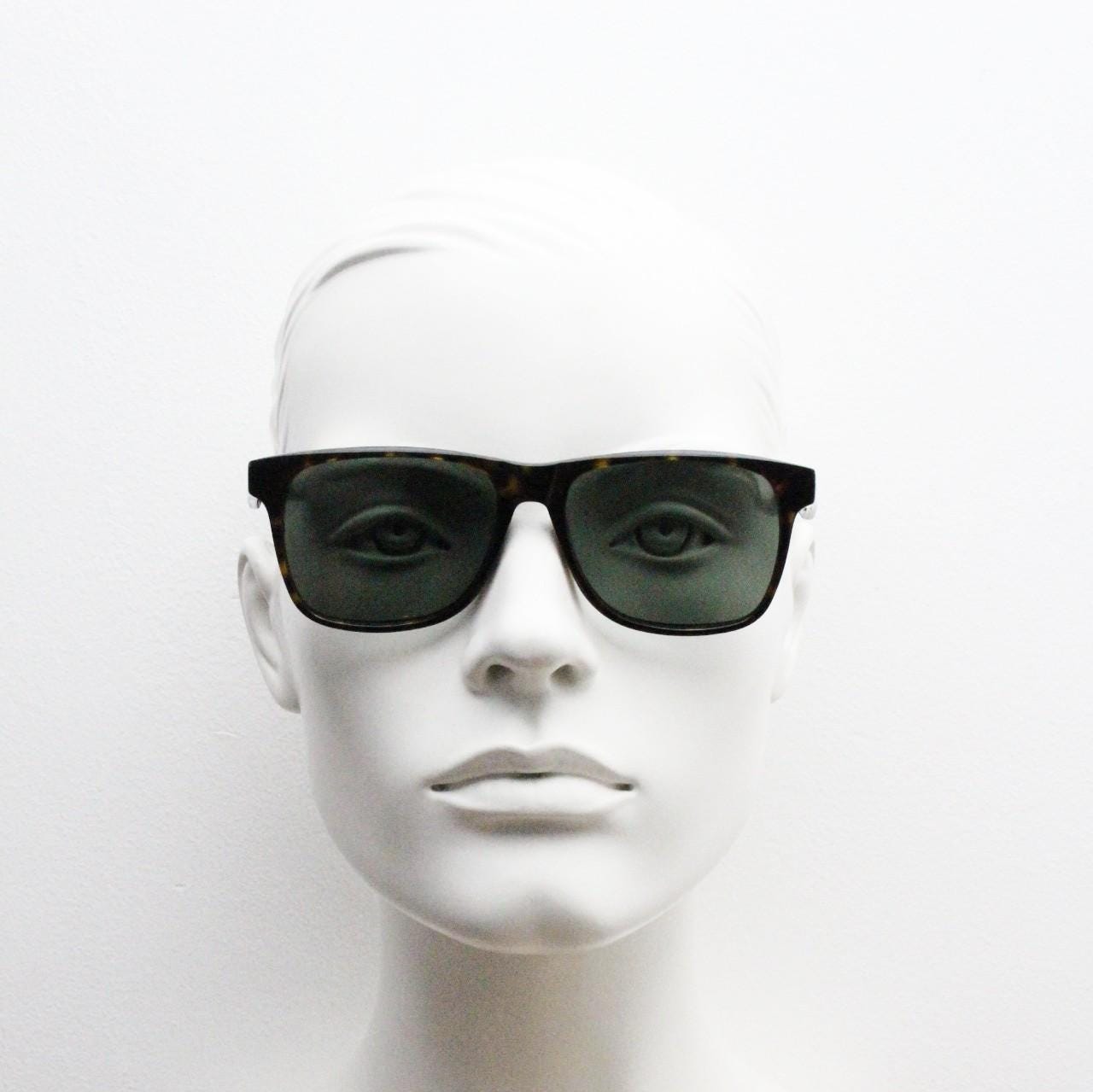 Bailey Nelson refined rectangular wayfarer sunglasses. All time classic vintage format. Hand made dark tortoise frame with green lenses