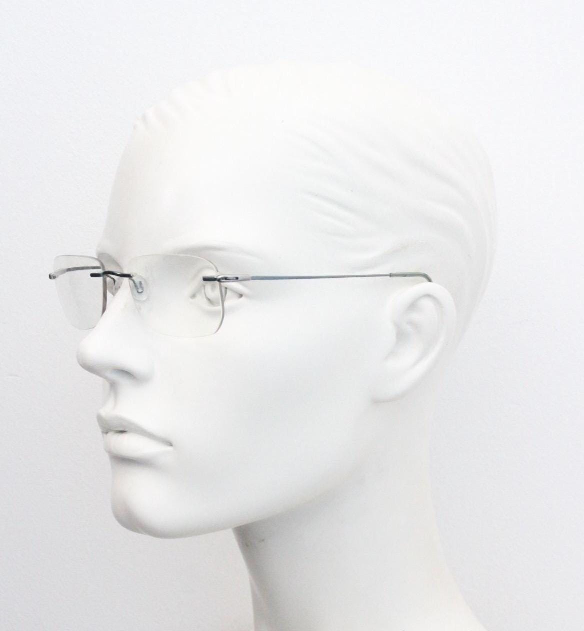 Silhouette rectangular frameless eye glasses model 7554 made in Austria. Minimal lightweight titanium optical frame. Prescription RX