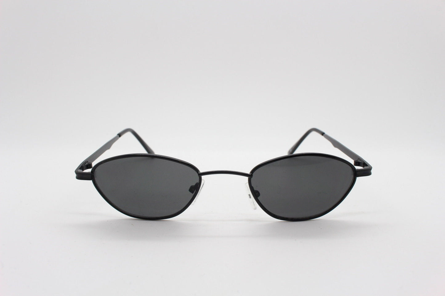 90s vintage low profile sunglasses. Minimal small black angular oval metal frame with matching lenses, Unused. BNWT