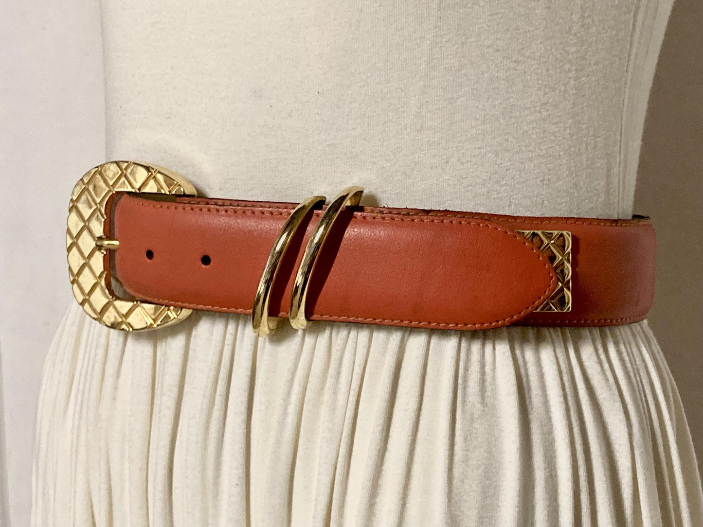 80s vintage womens dress / jeans belt in bright orange leather with golden metal squares. Made in France. Used in good condition