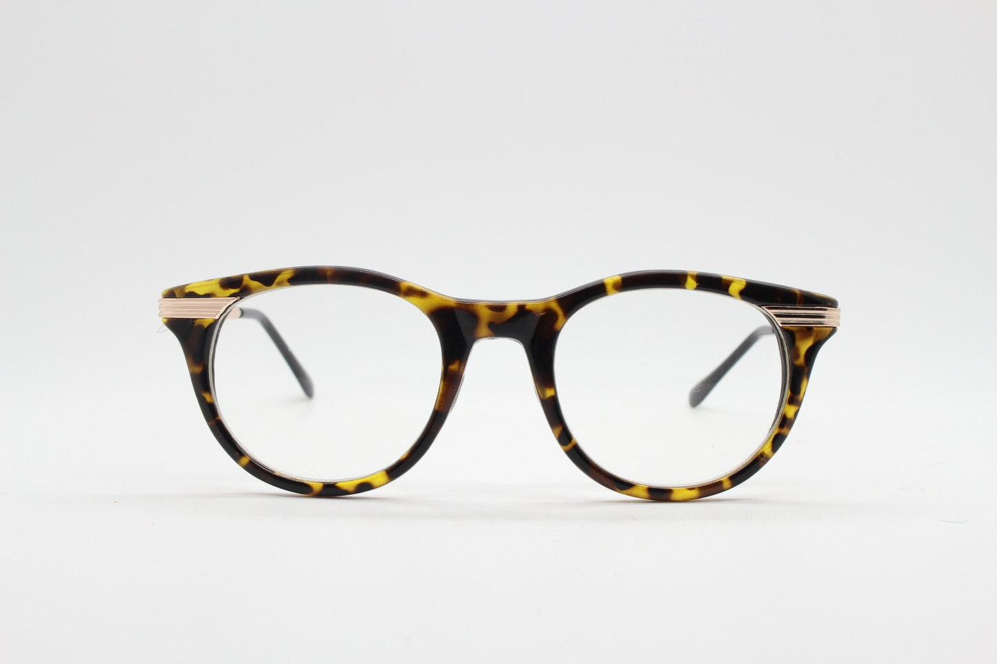90s vintage cat eye glasses in tortoise with gold metal arms. 50s, 60s style cateye prescription optical frames. Clear lens eyeglasses. RX
