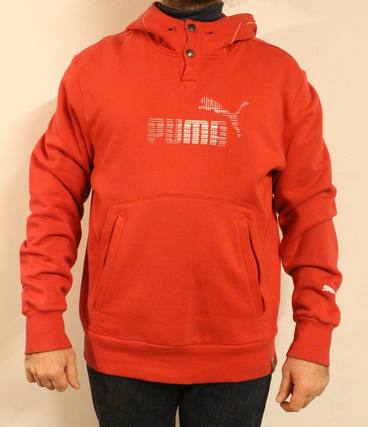 Puma red hoody with big chest logo. Unisex sports pullover sweatshirt with front muffler pockets. UK size L