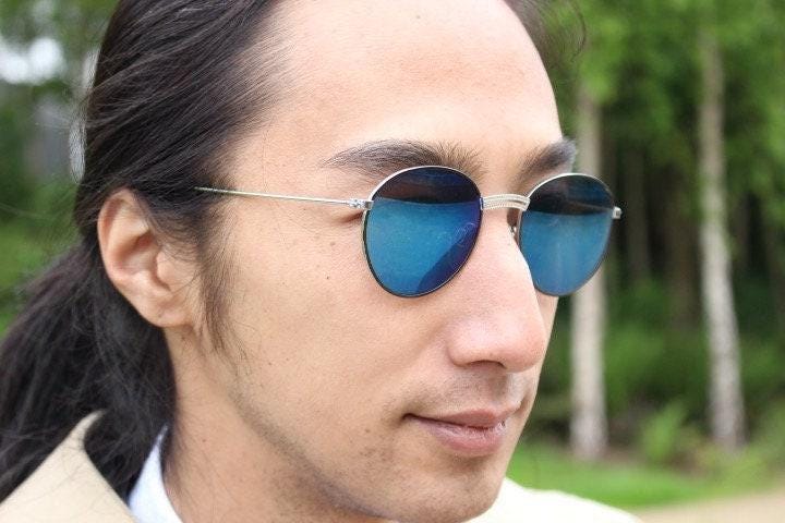 90s vintage oval panto sunglasses. Brushed bronze metal frame with cool blue mirror lenses and black slender arms. Unused NOS