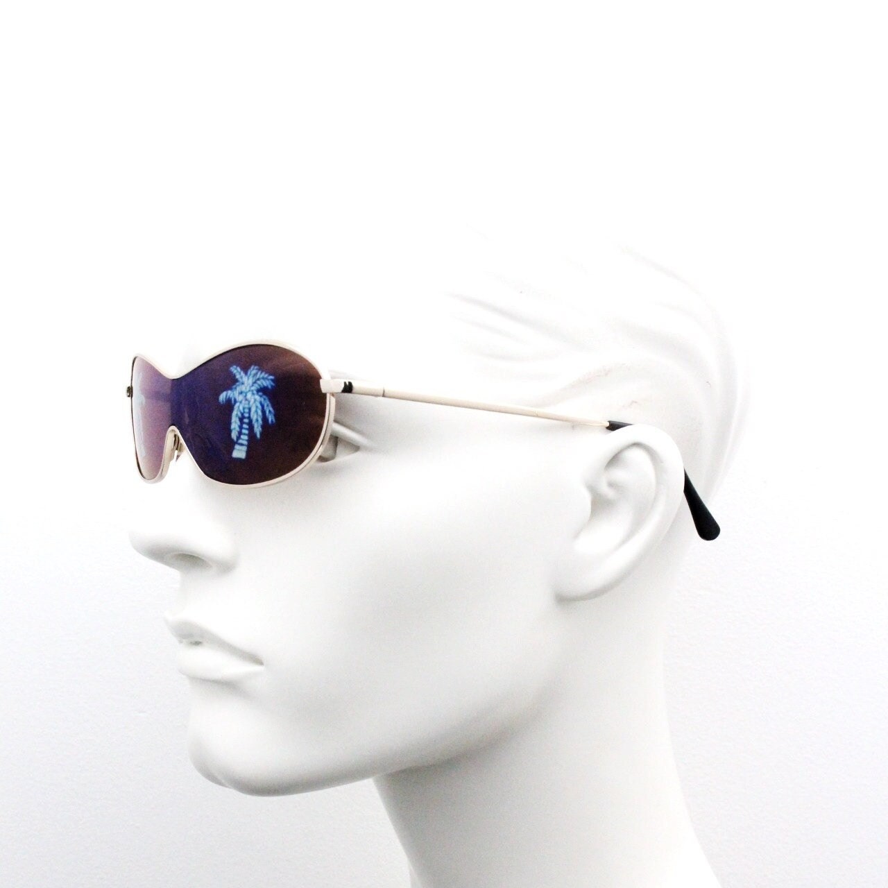 Party monster Y2K vintage visor sunglasses. Wraparound mono lens mini mask shield design with mind melting palm tree print. Unused NOS