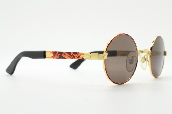 Optical City 90s vintage small round undersized sunglasses made in Italy. Handsome metallic tiger pattern on quality 1920s repro frame. NOS