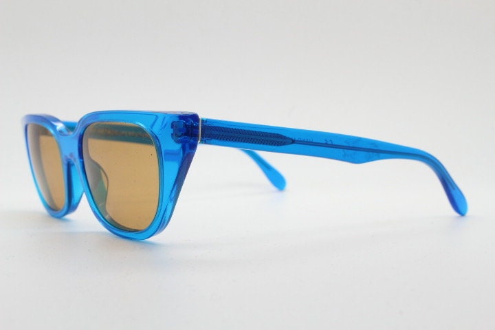 Retrosuperfuture thick cat eye sunglasses hand made in Italy. Intense blue acetate chunky frame with contrasting brown lenses. BNWOT