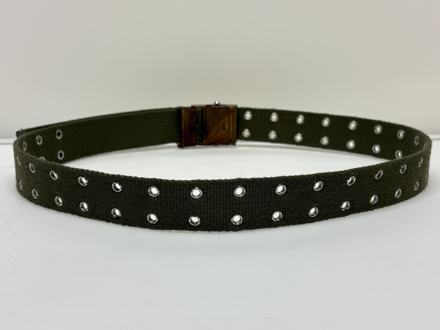 90s vintage canvas army style belt. Khaki green with 2 rows of silver metal holes. Slide lock gold buckle. Webbing. Fully adjustable