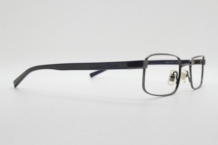 Calvin Klein collection rectangular eye glasses model 582 made in Japan. Gunmetal grey wire optical frames. Prescription eyeglasses. RX