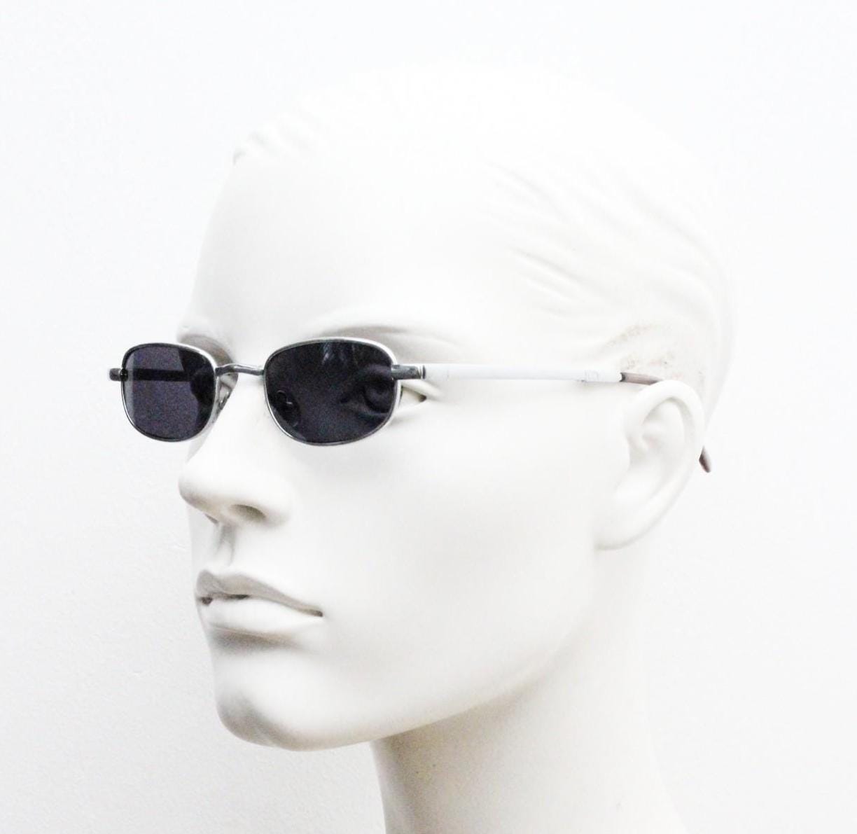 90s micro foldable rectangular sunglasses. Dark grey lenses in a small chrome folding compact frame. Folder. Rave 2000s. Y2K NOS