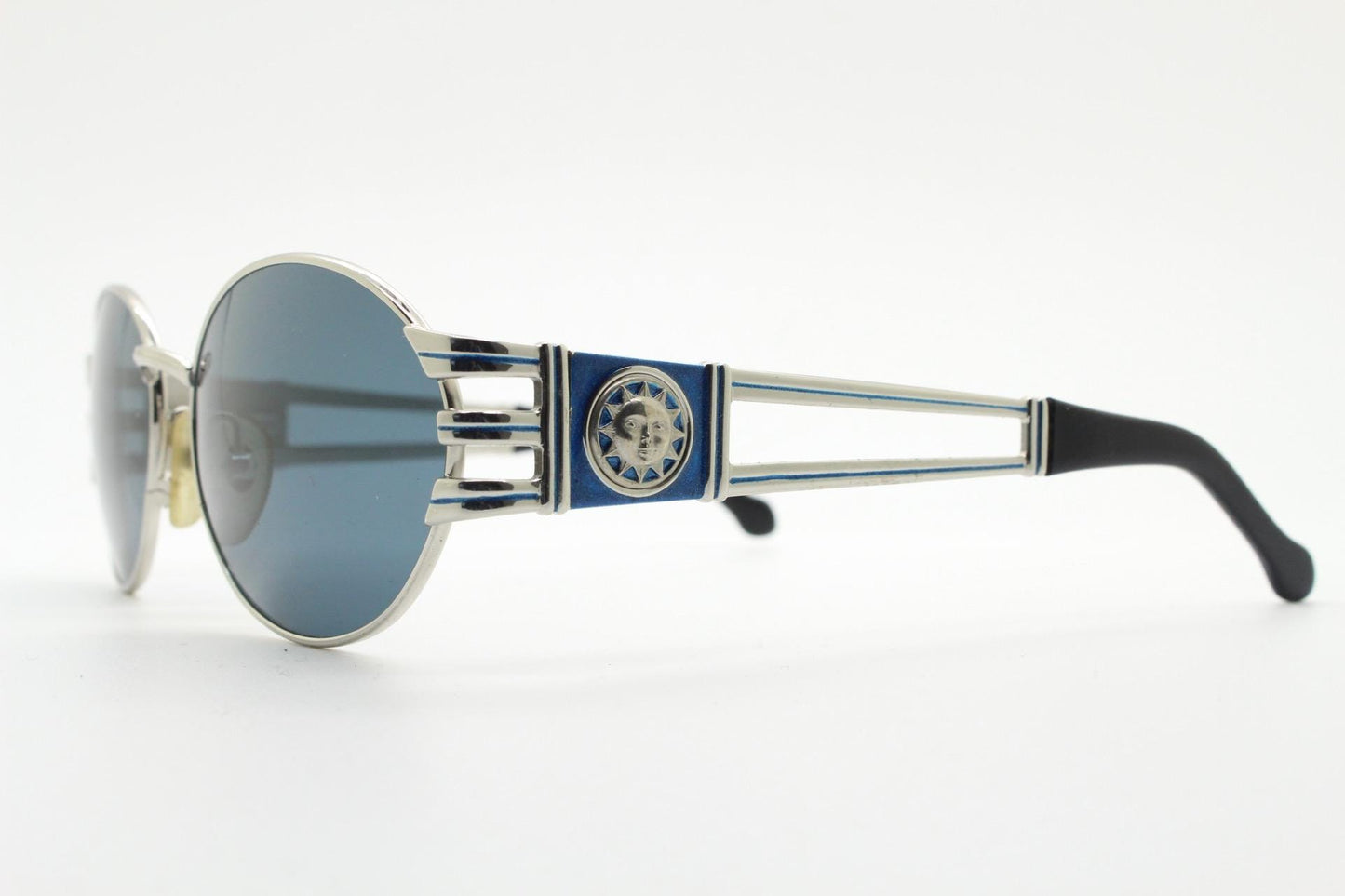 Sunsweet 90s vintage metal oval sunglasses made in Italy. Definitive ornate temple design with classical sun crests in silver chrome. NOS