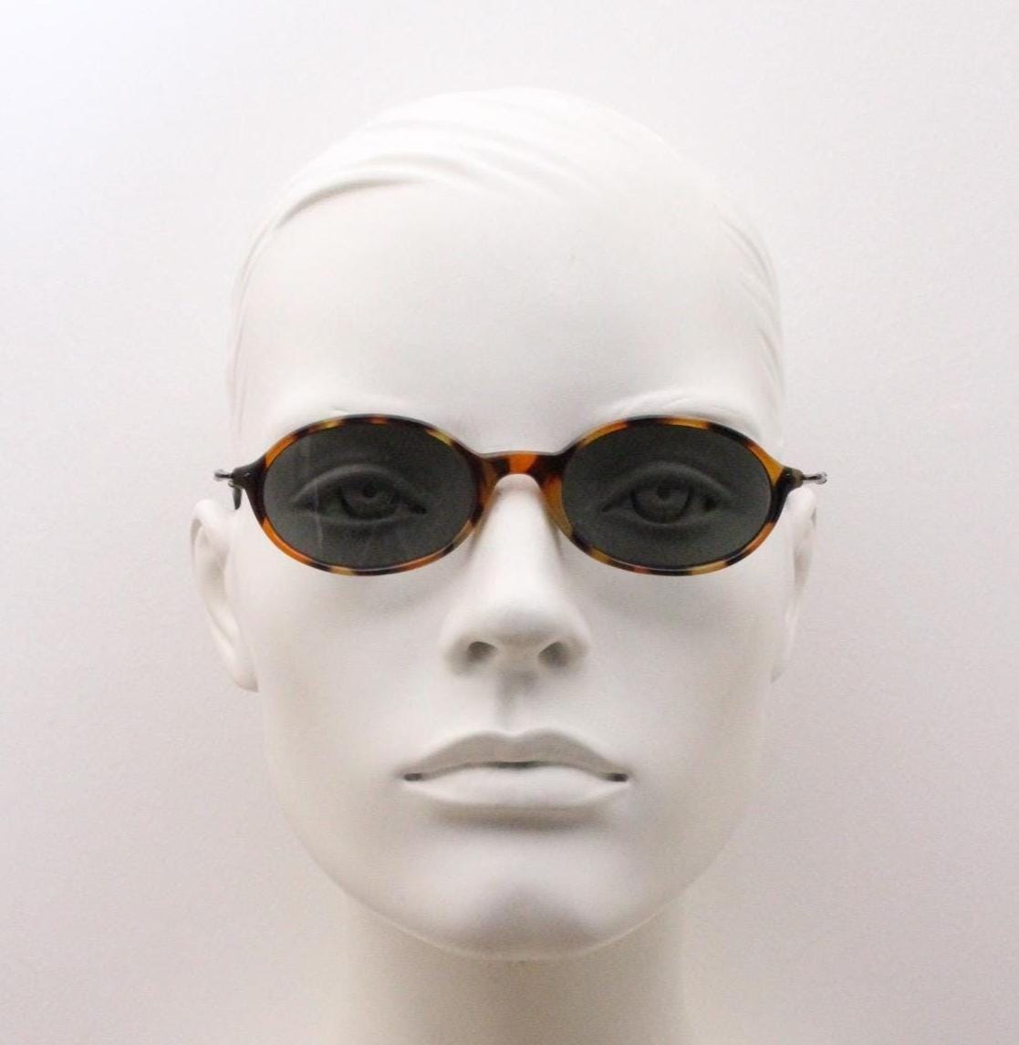 90s vintage oval sunglasses. Honey tortoise frame with refined slim 'industrial tech' style arms. Micro. Unused NOS