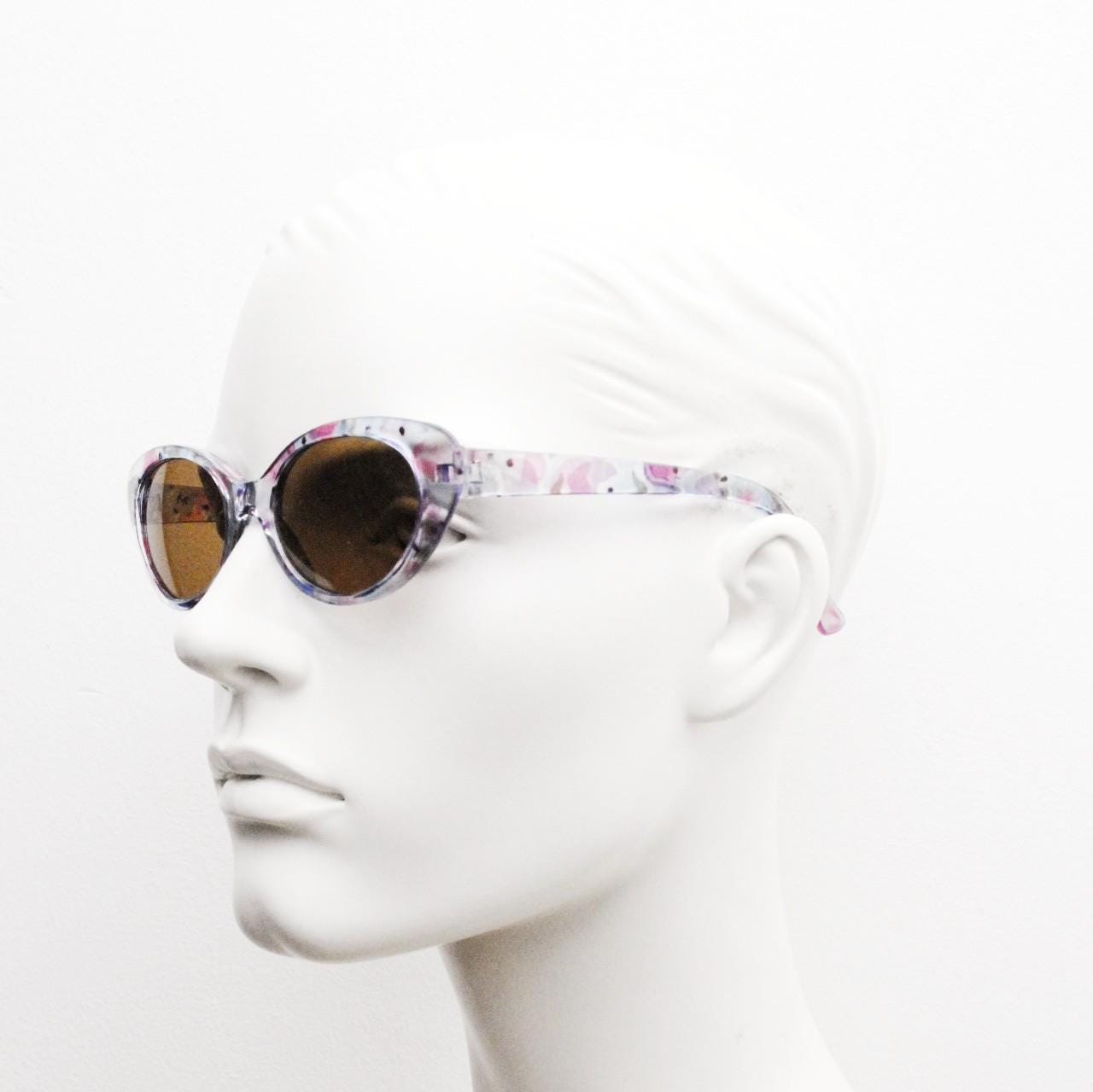 90s vintage oval cat eye sunglasses. Vibrant transparent multi coloured frame with mid tone brown lenses. 80s. NOS. BNWT