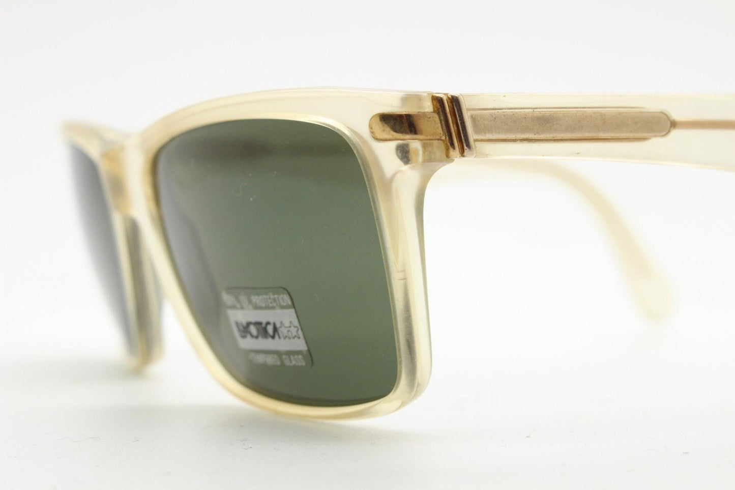 Luxottica 90s vintage rectangular sunglasses made in Italy. Transparent yellow acetate chunky frame with contrasting dark green lenses. BNWT
