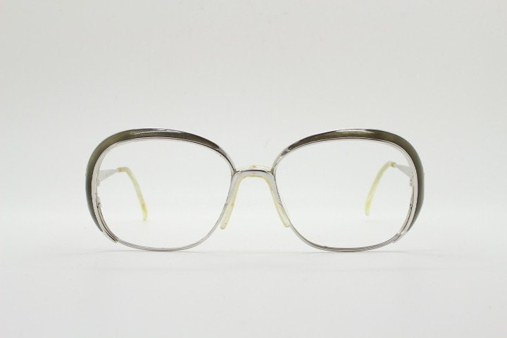 Christian Dior 70s vintage big round eye glasses made in Austria. Silver optical frame with dynamic reflective grey enamel. Prescription RX