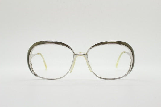 Christian Dior 70s vintage big round eye glasses made in Austria. Silver optical frame with dynamic reflective grey enamel. Prescription RX