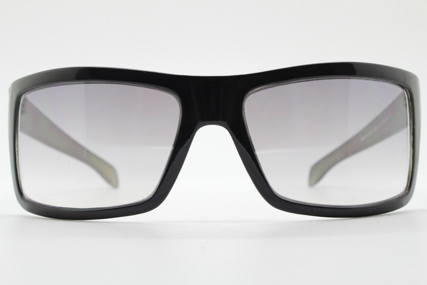 Y2k vintage wrap around large rectangular sunglasses. Curved black gloss frame with tasteful graduating lenses. 2000's NOS
