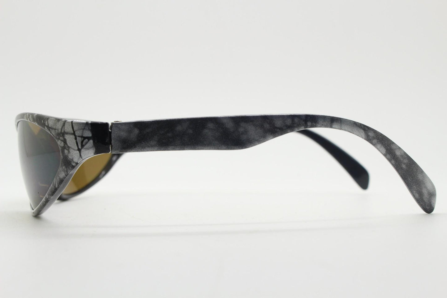90s vintage sport shield aerodynamic sunglasses. Silver and black marble print wraparound bug eye visor with brown lenses. 2000's. Y2K
