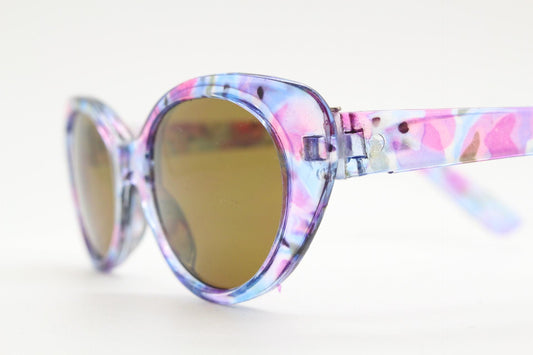 90s vintage oval cat eye sunglasses. Vibrant transparent multi coloured frame with mid tone brown lenses. 80s. NOS. BNWT